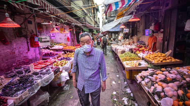 Man at a "wet market" in Guangzhou, Guangdong province, China, April 20, 2020. EPA/ALEX PLAVEVSKI