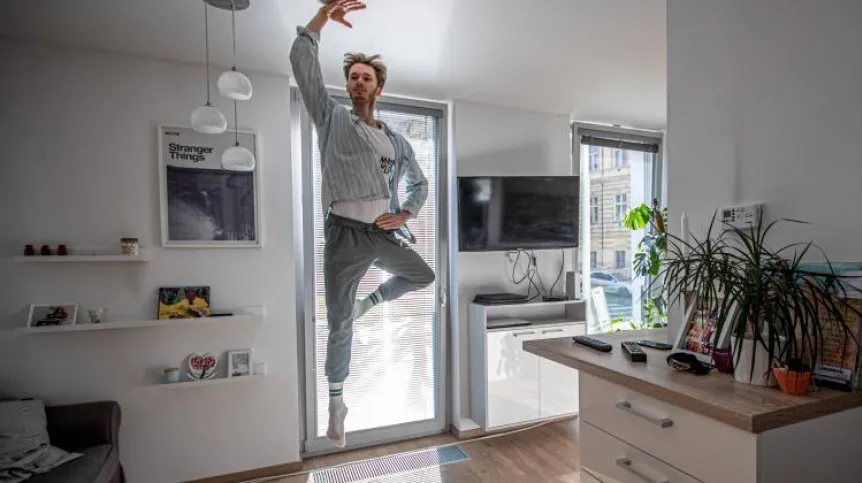 The Czech National Ballet soloist Patrik Holecek practices at home in Prague. Credit: EPA/PAP