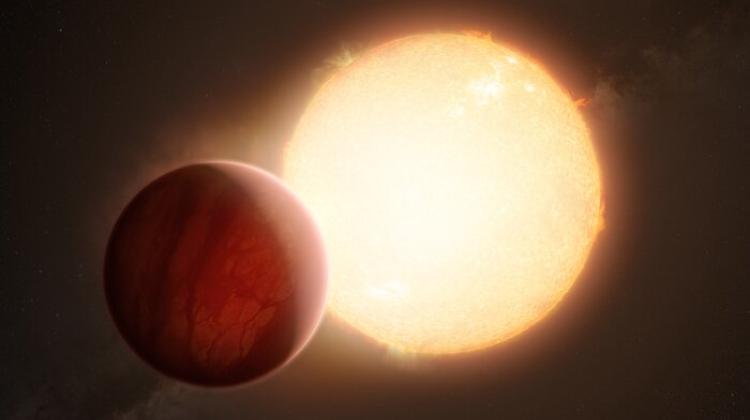  Artystyczna wizja ultragorącego jowisza dokonującego tranzytu na tle swojej gwiazdy. Źródło: ESO/M. Kornmesser.