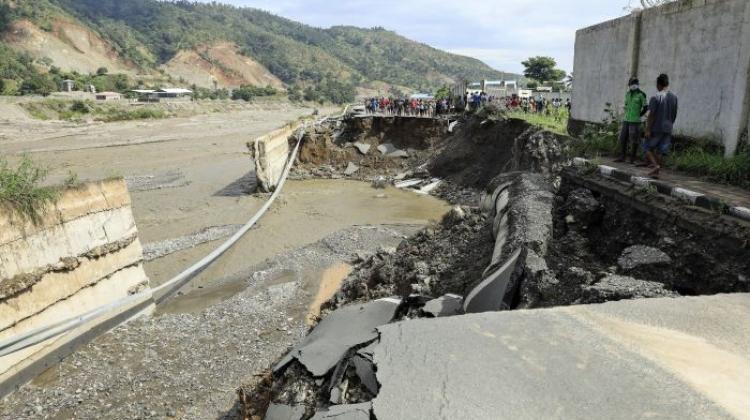 Road damaged by flooding in Dili, East Timor, after tropical cyclone Seroja. April 6, 2021 EPA/ANTONIO DASIPARU