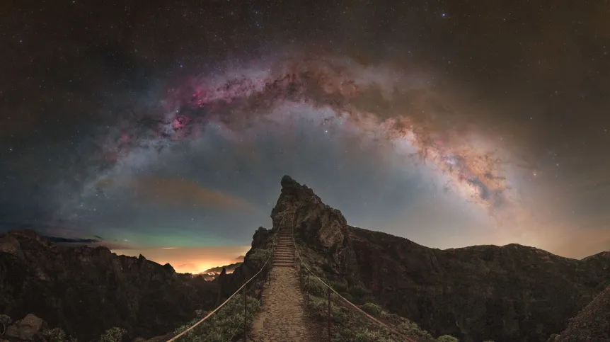 The Milky Way above a viewpoint in Madeira. The photo is titled 'Stairway to the Milky Way'. The image was featured on May 29, 2024 by NASA as the Astronomy Picture of the Day (APOD). Credit: Marcin Rosadziński.