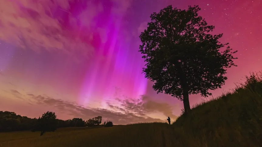 NASA APOD May 12, 2024. Red Aurora over Poland. Credit: Mariusz Durlej