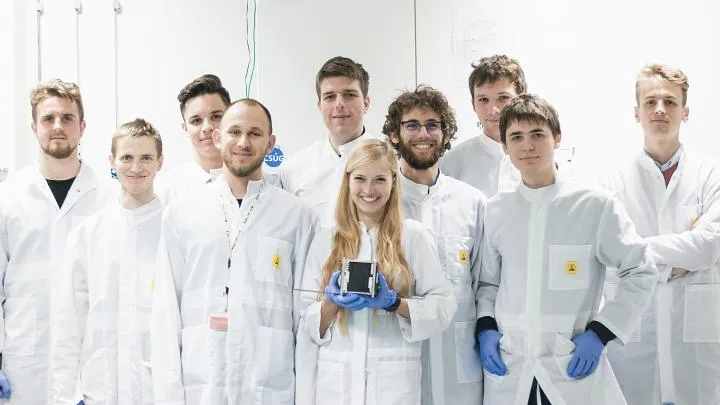 Students from the KRAKsat team with their satellite. Credit: KRAKsat