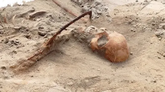 Burial of a woman buried with a sickle and padlock from the 17th-century cemetery in Pień, Source: Pień Project/TSE Evolution