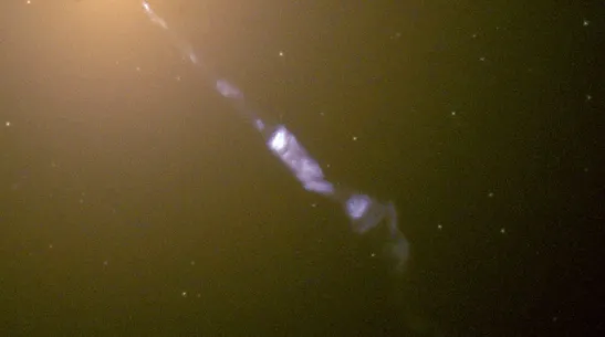 The elliptical galaxy M87 emitting a jet, in an image from the Hubble telescope (due to the large angle between the jet and the line of sight, the centre is not classified as a blazar!) Wikipedia, public domain